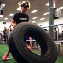 Therapist Kasia Tire Flipping in a CrossFit Competition